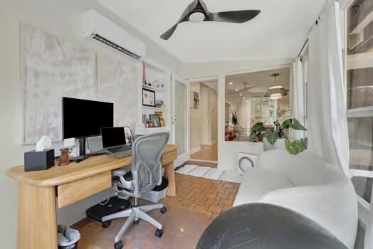 home office with an AC wall unit, built in shelves, and ceiling fan