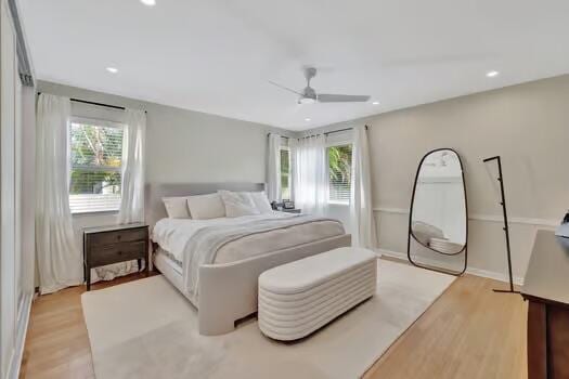 bedroom with light wood-type flooring and ceiling fan