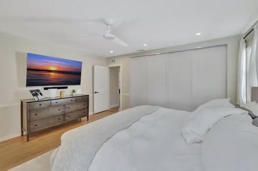 bedroom featuring light hardwood / wood-style flooring and ceiling fan