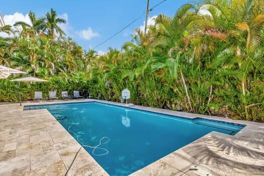 view of swimming pool with a patio area