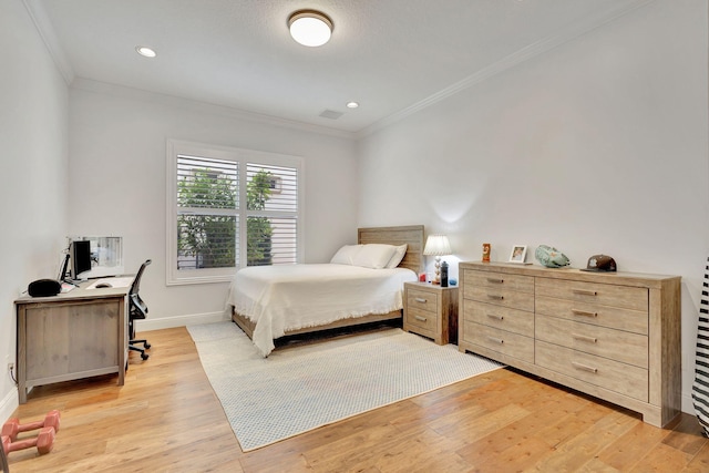 bedroom with light hardwood / wood-style flooring and ornamental molding