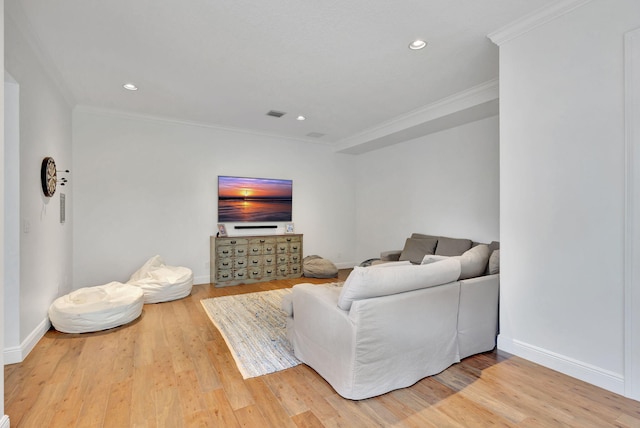 living room with crown molding and wood-type flooring