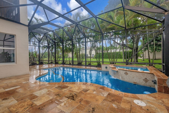 view of swimming pool with an in ground hot tub, glass enclosure, and a patio area