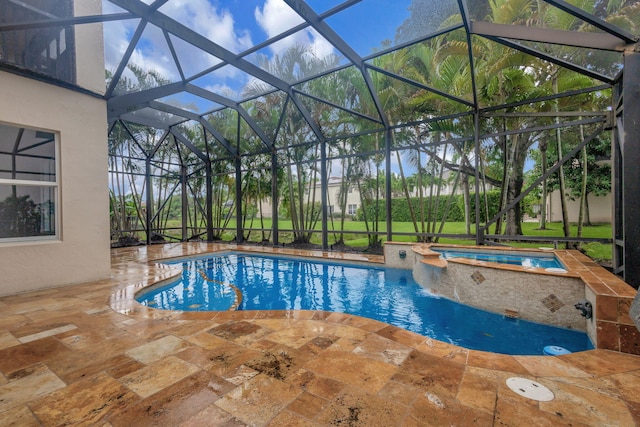 9232 Nugent Trl, West Palm Beach, FL 33411 - view of swimming pool with a patio, glass enclosure, and a pool with connected hot tub