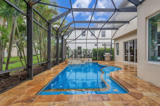 view of swimming pool featuring an in ground hot tub, glass enclosure, and a patio area