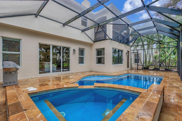 view of swimming pool with glass enclosure, a patio, and a grill