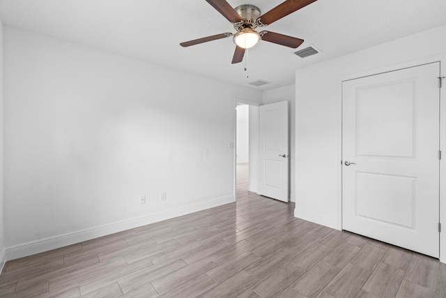 unfurnished bedroom with light hardwood / wood-style floors and ceiling fan