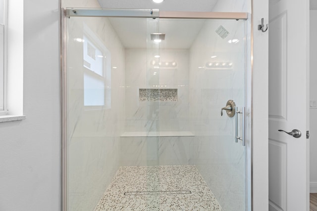 bathroom featuring an enclosed shower