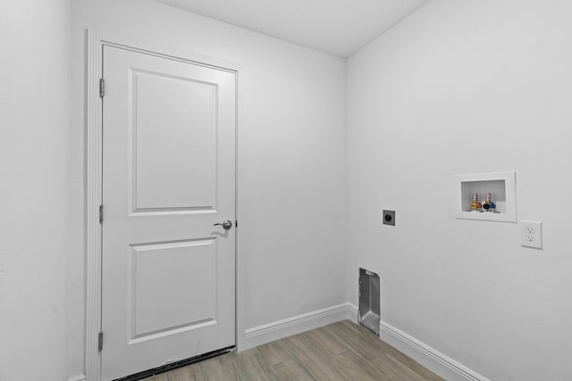 laundry room with washer hookup, hookup for an electric dryer, and light hardwood / wood-style flooring