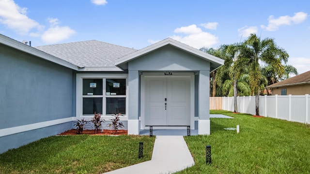 entrance to property with a yard