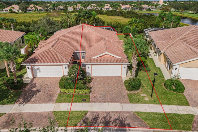 birds eye view of property with a water view