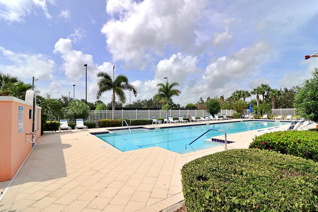 view of swimming pool featuring a patio area