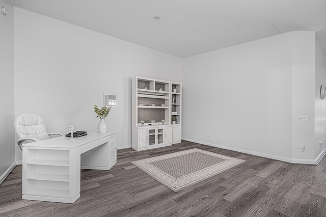 unfurnished office featuring dark hardwood / wood-style flooring