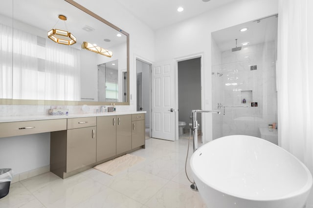 bathroom featuring marble finish floor, a shower stall, vanity, and recessed lighting