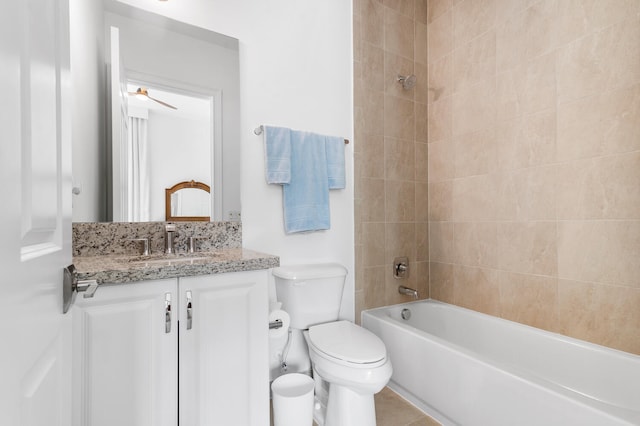 bathroom featuring shower / washtub combination, vanity, and toilet