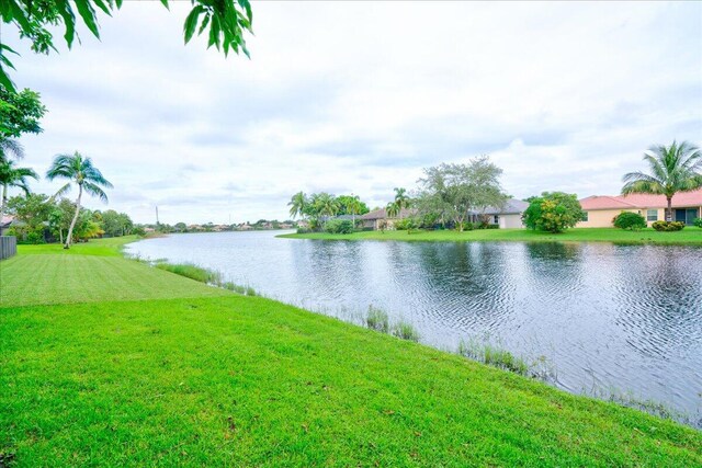 9863 Royal Cardigan Way, West Palm Beach, FL 33411 - view of front of house featuring decorative driveway, stucco siding, and a tiled roof