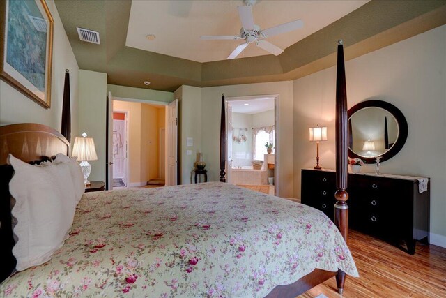 9863 Royal Cardigan Way, West Palm Beach, FL 33411 - bathroom featuring vanity, a stall shower, a bath, wood finished floors, and recessed lighting