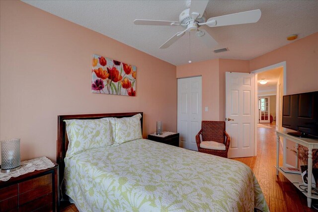 9863 Royal Cardigan Way, West Palm Beach, FL 33411 - bedroom featuring wood finished floors and ceiling fan