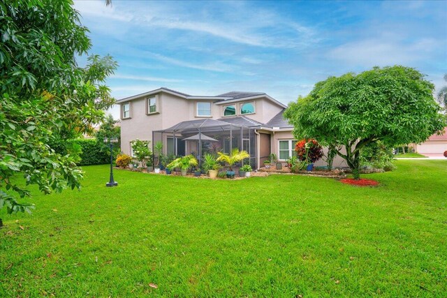 9863 Royal Cardigan Way, West Palm Beach, FL 33411 - view of front of home with decorative driveway, stucco siding, a front lawn, and an attached garage