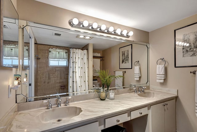 bathroom with vanity and walk in shower