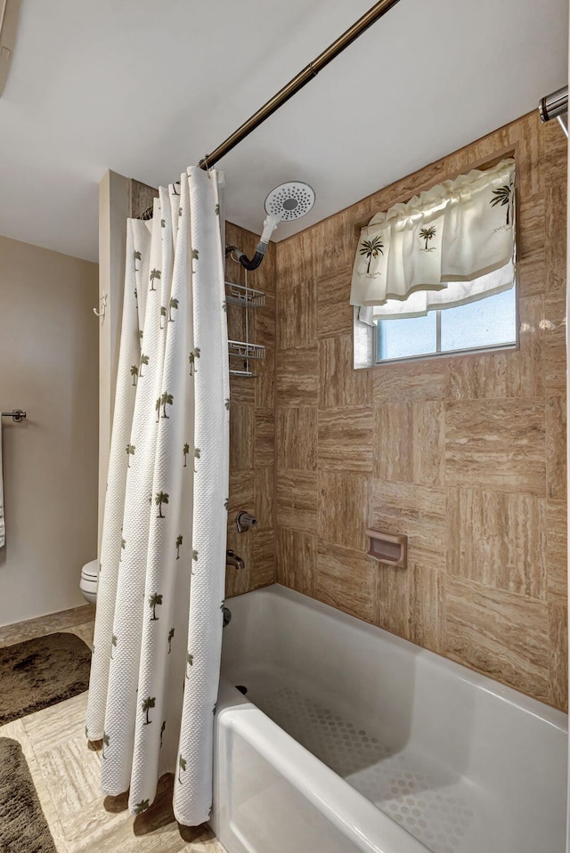 bathroom featuring toilet and shower / tub combo with curtain