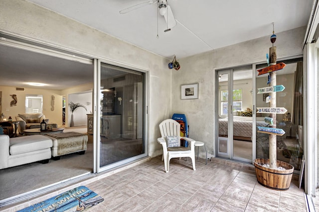 view of patio featuring ceiling fan