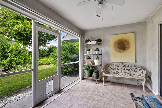 sunroom featuring ceiling fan