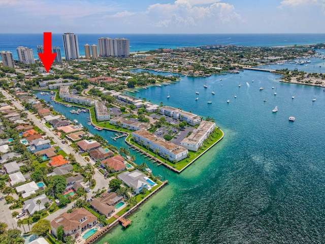 birds eye view of property with a water view