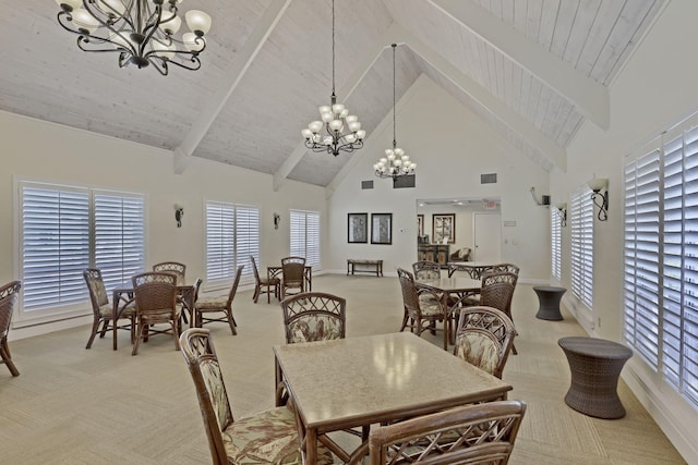 carpeted dining area featuring beam ceiling, high vaulted ceiling, and an inviting chandelier