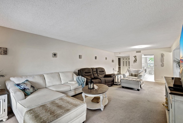 carpeted living room featuring a textured ceiling