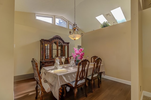 1138 SW Greenbriar Cv, Port Saint Lucie, FL 34986 - dining area featuring a skylight, high vaulted ceiling, wood finished floors, and baseboards