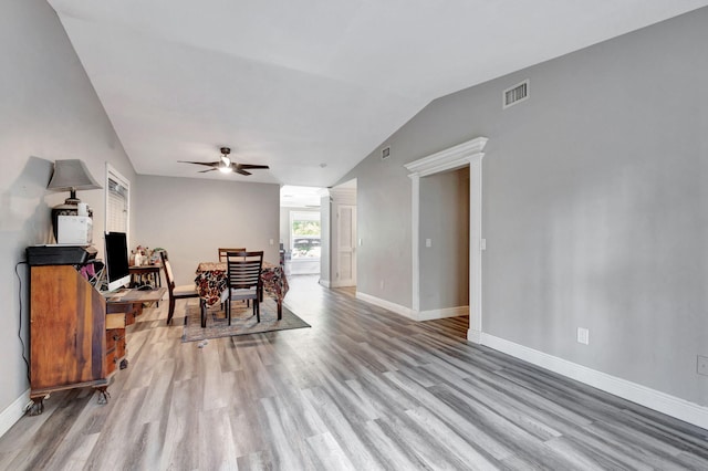 interior space featuring ceiling fan, light hardwood / wood-style flooring, and lofted ceiling