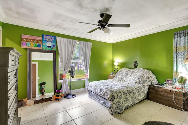 tiled bedroom featuring ornamental molding and ceiling fan