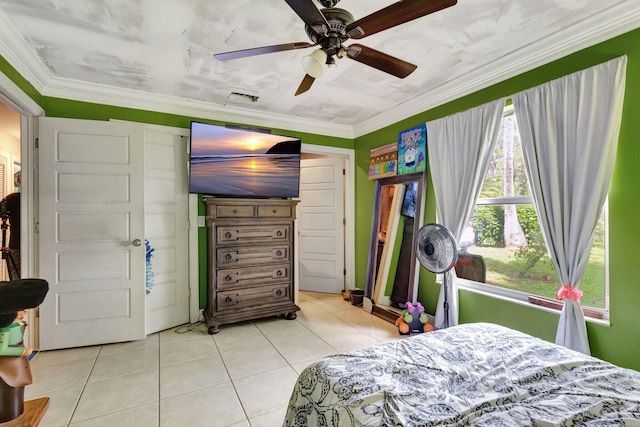 bedroom with light tile patterned floors, ceiling fan, and crown molding