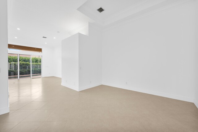 tiled empty room with crown molding