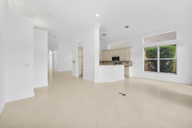 unfurnished living room with light tile patterned floors