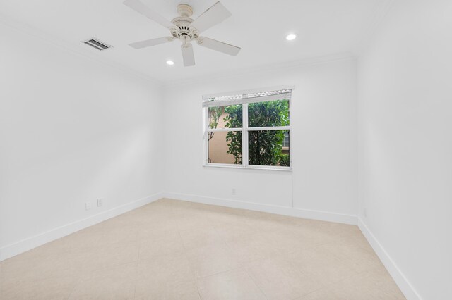 spare room featuring crown molding and ceiling fan