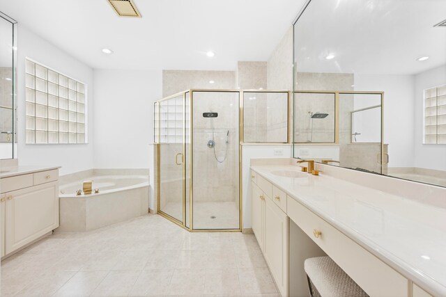 bathroom featuring vanity, separate shower and tub, and tile patterned flooring