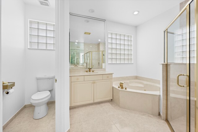 full bathroom featuring vanity, plus walk in shower, toilet, and tile patterned flooring