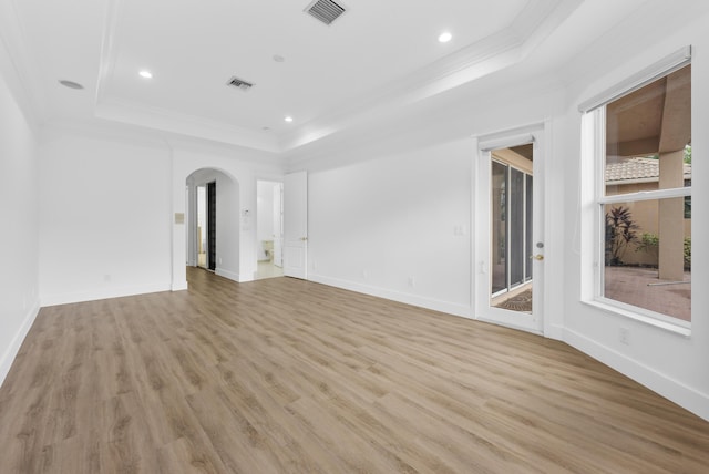 7234 Vesuvio Pl, Boynton Beach, FL 33437 - spare room featuring visible vents, arched walkways, a raised ceiling, and crown molding
