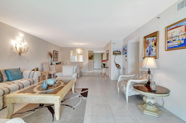 tiled living room featuring an inviting chandelier