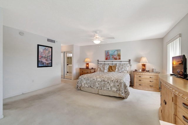 bedroom featuring ceiling fan and light colored carpet