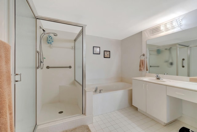 bathroom with tile patterned flooring, plus walk in shower, and vanity