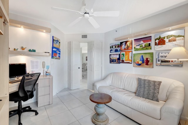 tiled office with ceiling fan and built in desk