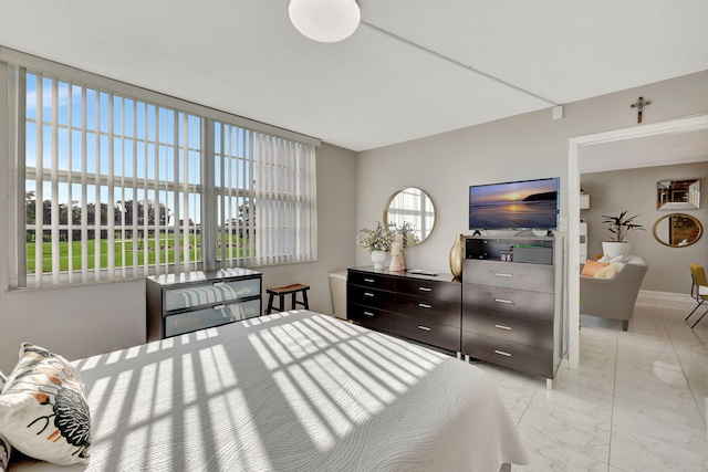 1480 NW 80th Ave Unit 201, Margate, FL 33063 - bedroom with light marble finish flooring and baseboards