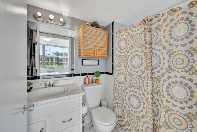 bathroom featuring toilet, a shower with curtain, vanity, and tile walls