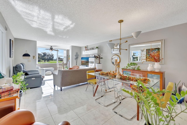 1480 NW 80th Ave Unit 201, Margate, FL 33063 - dining room featuring light marble finish flooring, a textured ceiling, and ceiling fan