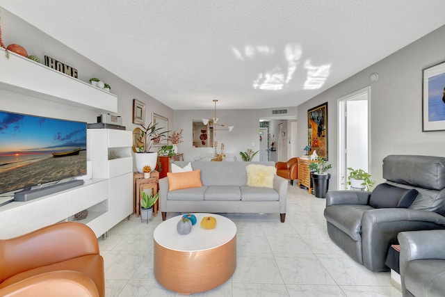 1480 NW 80th Ave Unit 201, Margate, FL 33063 - living room featuring light marble finish flooring and a textured ceiling