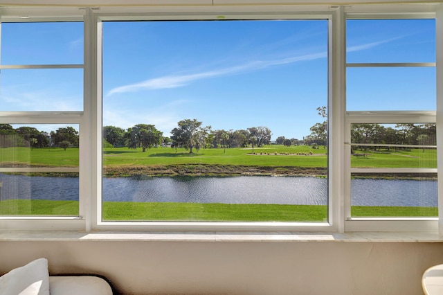 unfurnished sunroom with a water view and plenty of natural light