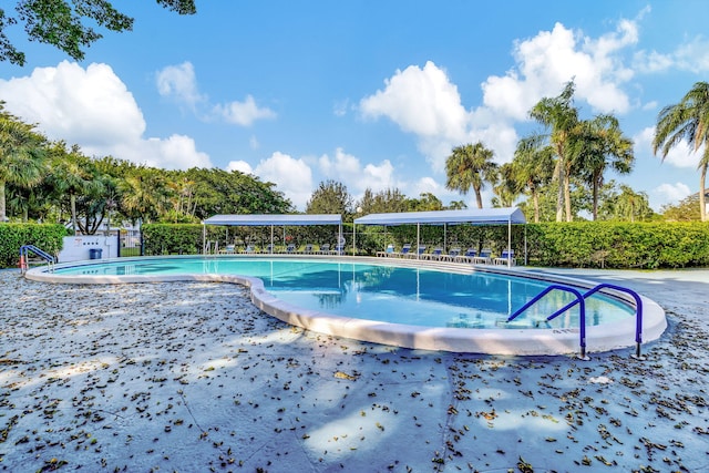 1480 NW 80th Ave Unit 201, Margate, FL 33063 - community pool with a patio area and fence